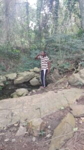 A man drinking water from the Sesemi pond