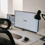 A clean and modern home office desk with a focus on productivity and technology.